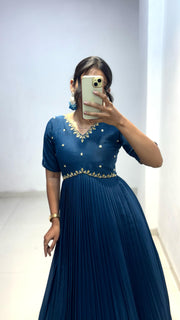 Look at our morpinchh color full length dress with hand embroidered neckline
