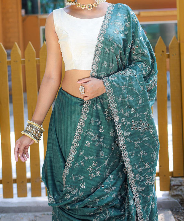 Captivating Silk Floral Design Teal Green Color Saree