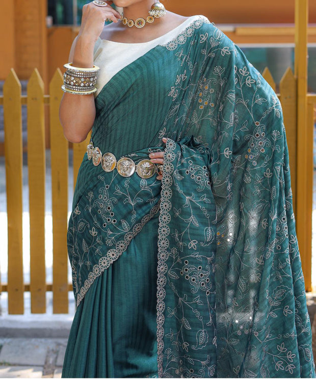 Captivating Silk Floral Design Teal Green Color Saree