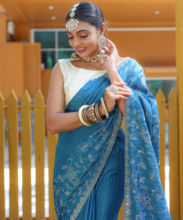 Captivating Silk Floral Design Teal Blue Color Saree